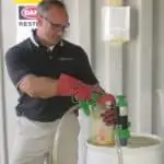 pesticide with red gloves